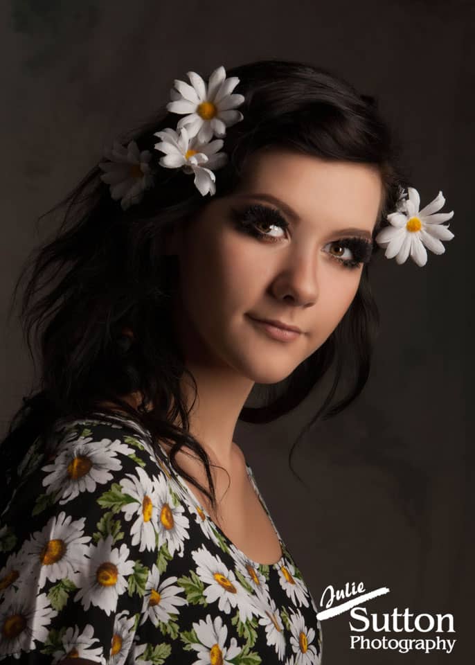senior portrait in a daisy dress
