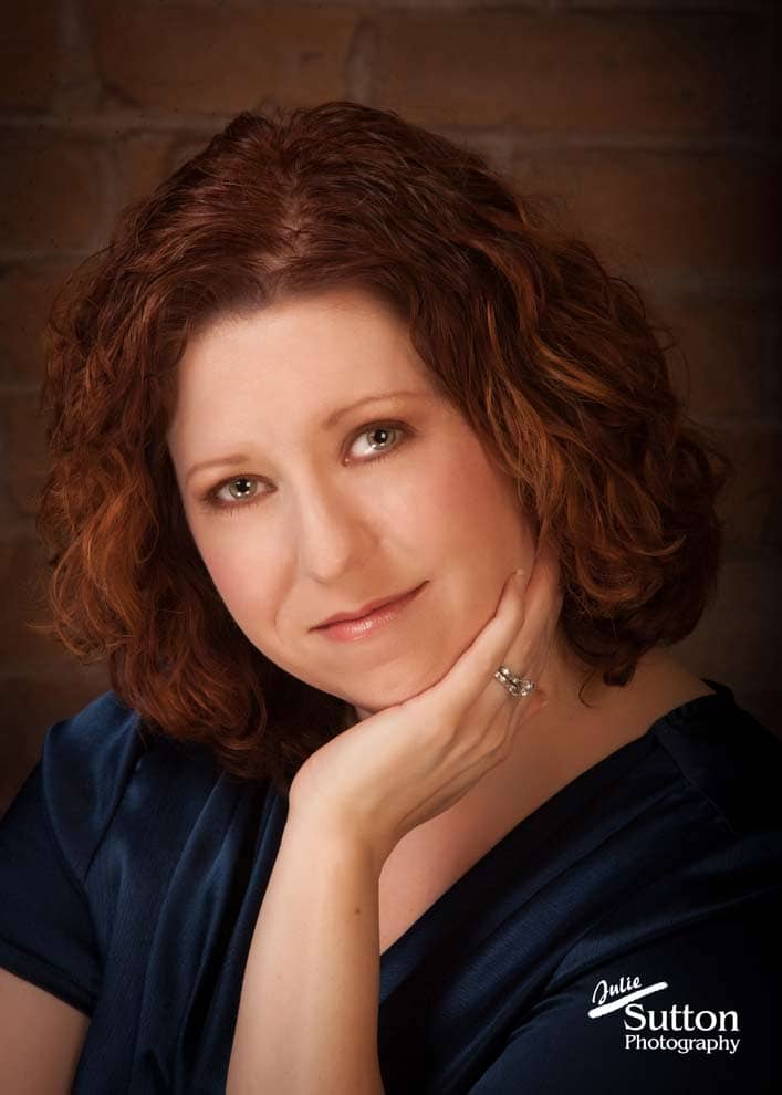 woman-headshot-ring-blue-shirt